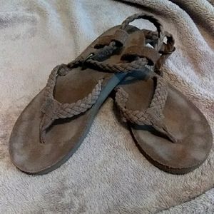 Brown Teva leather sandles.